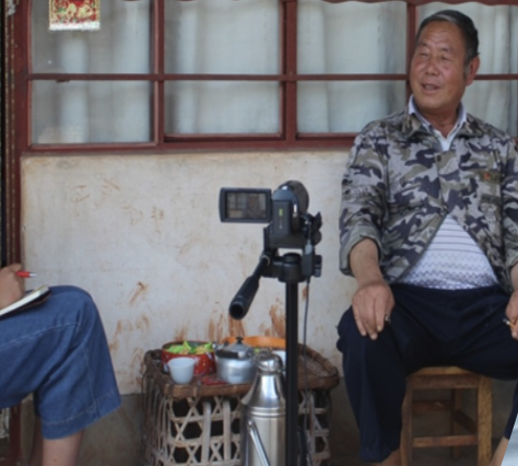 Yu interviewing a local elder